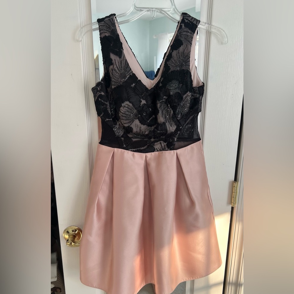 Pink and black beaded dress with v neckline and pockets